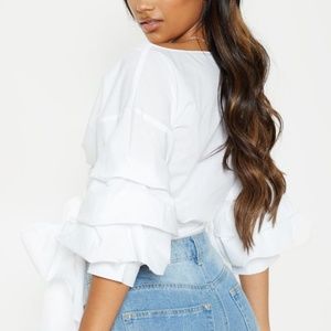 WHITE OVERSIZED RUFFLE SLEEVE LOW SHOULDER SHIRT